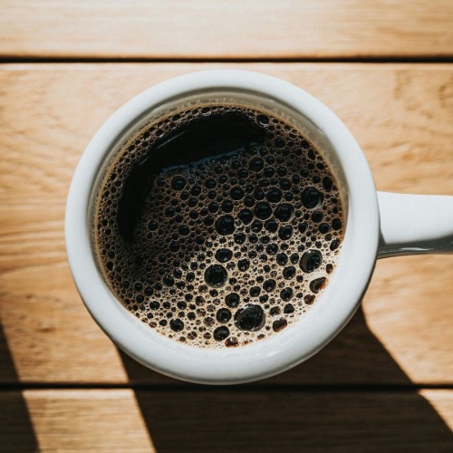 a cup of coffee on a table